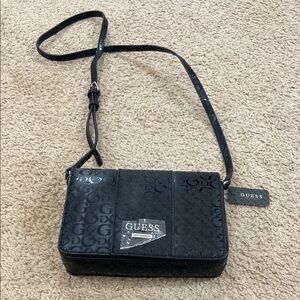 Guess Black Crossbody Bag with Adjustable Strap and Silver Hardware
